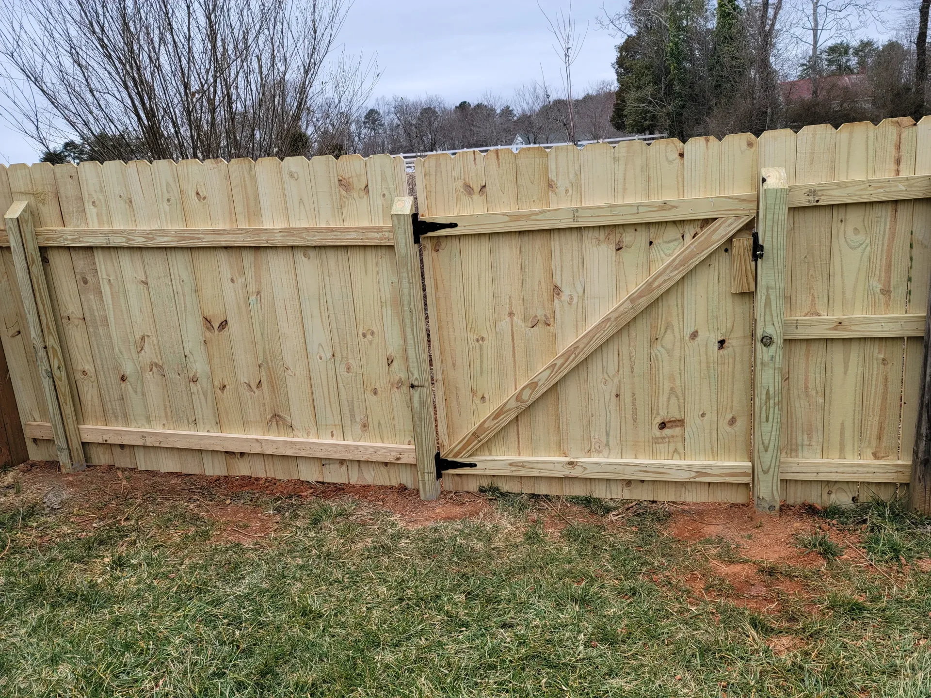 New wooden picket fence